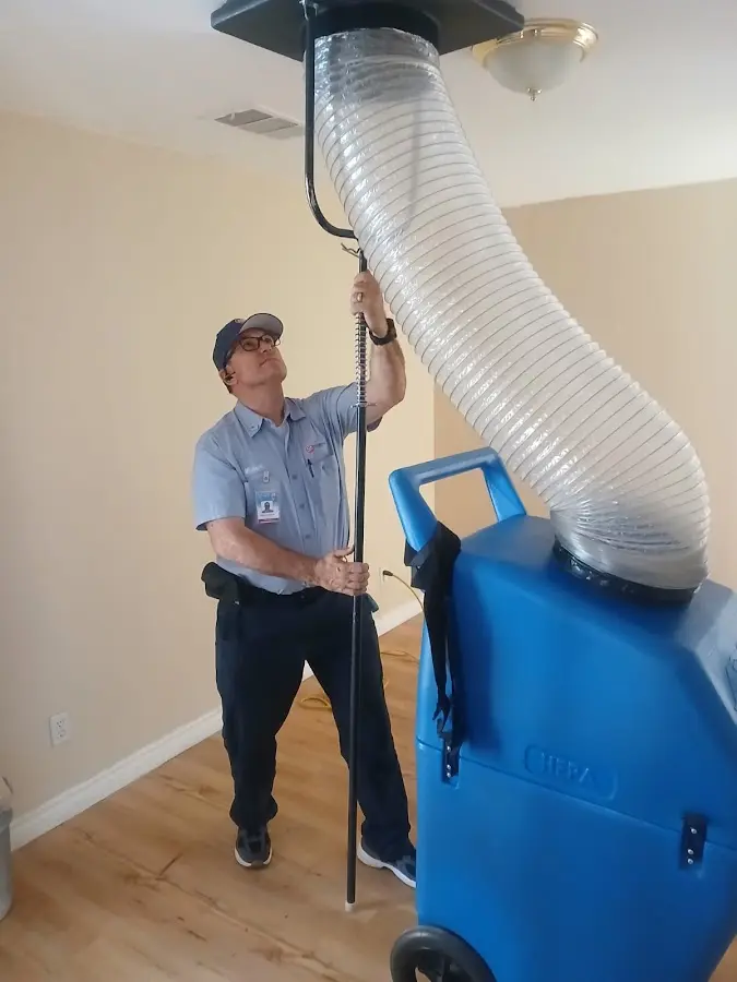 Furnace Tune-Up technician using HEPA equipment in Morrisville